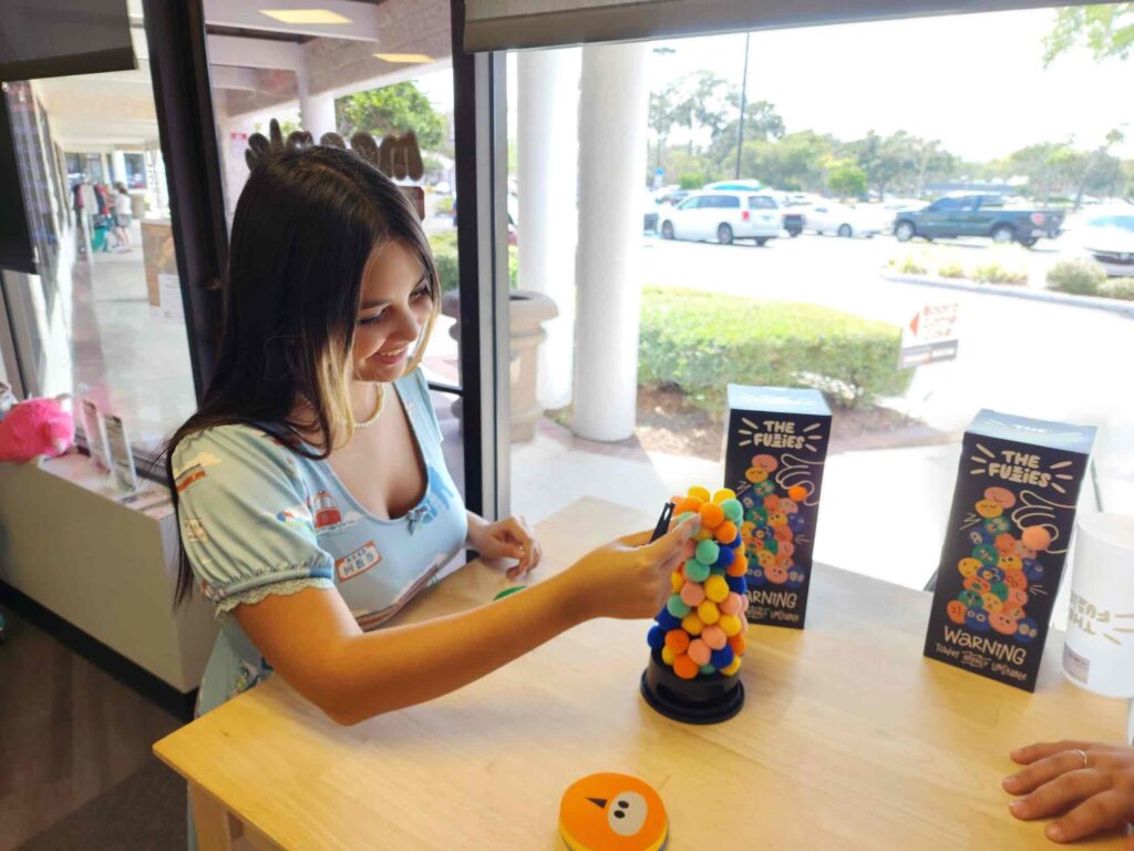 Girl playing game at Meeple Movers in Ocala